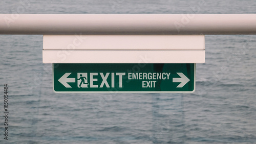 Close Up View Illuminated Green Exit Sign 