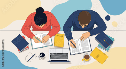 Overhead view of two students sitting at a desk with books, notebooks, laptop, and coffee, focused on their studies.