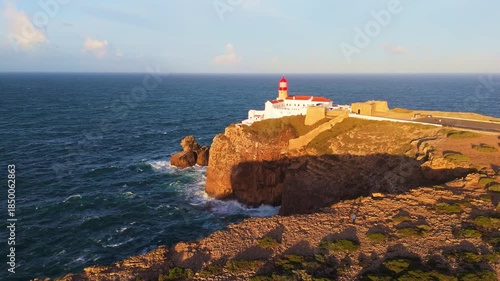 Cape Saint Vincent, Sao Vicente Lighthouse and Atlantic Ocean on Sunny Morning. Aerial View. Sagres, Algarve, Portugal. Moving Forward
