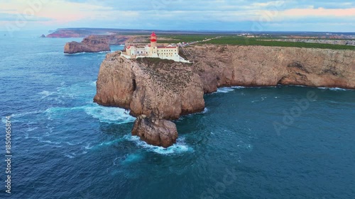 Cape Saint Vincent, Lighthouse, Cliffs and Atlantic Ocean in Evening Twilight. Aerial View. Sagres, Algarve, Portugal. Moving Forward