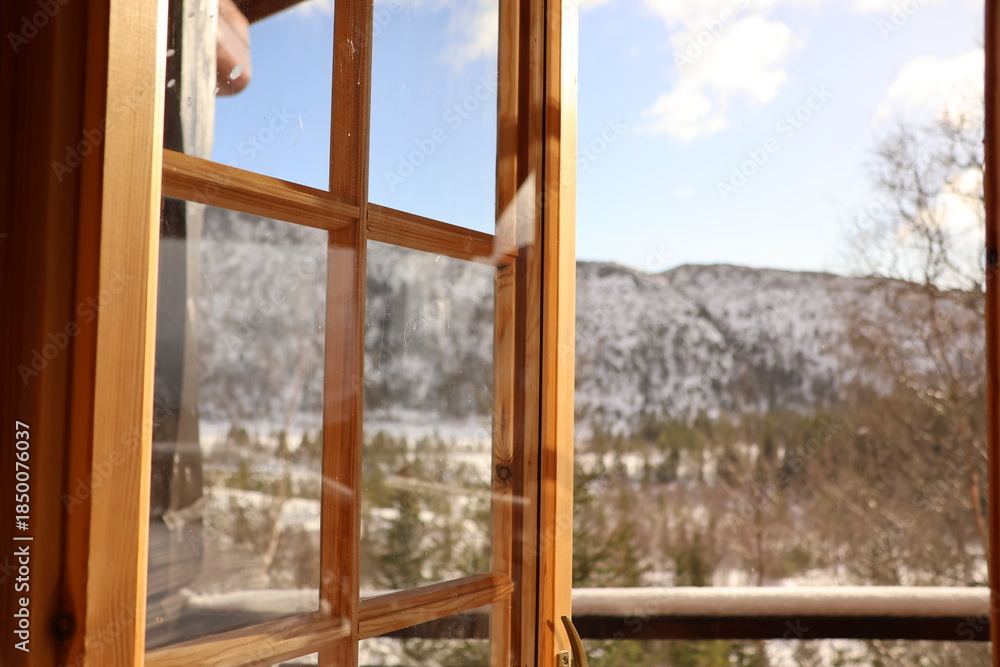 Fototapeta premium winter landscape with cabin window