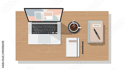 Overhead view of a wooden desk with a laptop coffee and notebooks