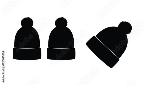Three black silhouette beanie hats with pom-poms, one tilted, showcasing winter fashion and cozy accessories.