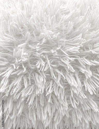 Fotografie White fluffy shag fur creating soft texture background
