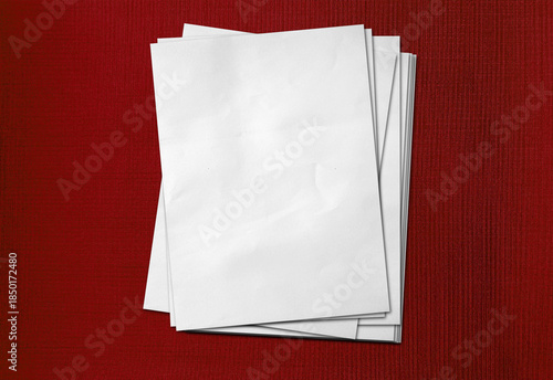 Blank Stack of A4 White Printer Paper Sheets placed on red fabric wallpaper background | Empty Clean Office Documentation Mockup with Copy Space for Text and Design.