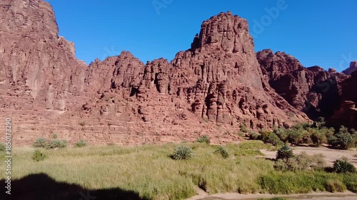 Al-Disah, Saudi Arabia: Panoramic footage of the stunning wadi Al-Disah canyon famous for its red rock and palm tree near Tabuk in the desert of Saudi Arabia. 