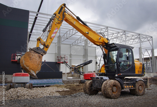 excavator working with a bucket on the construction of structures