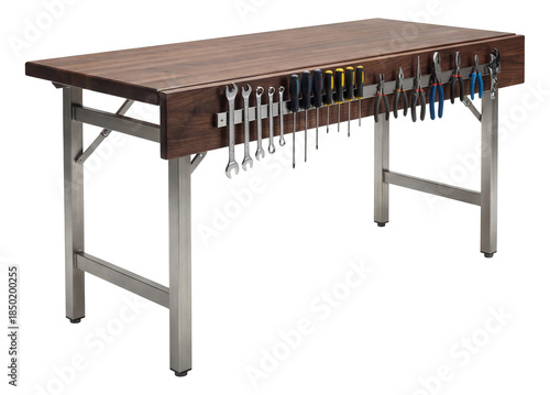 Folding workbench with a magnetic strip for tool storage in an engineering lab.