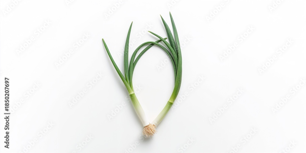 Fototapeta premium Fresh green onions placed on a white background, ideal for food styling or ingredient display, neutral setting