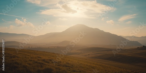 Sunrise over rugged mountai...