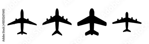 A top down view of four black airplane silhouettes in a row against a white background design element