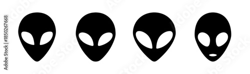 Four stylized alien heads with elongated shapes and distinctive eye placements in black and white