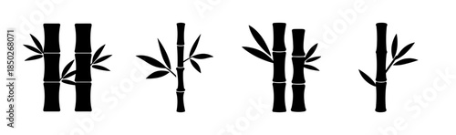 Illustration of four bamboo stalks with leaves in black silhouette against white background