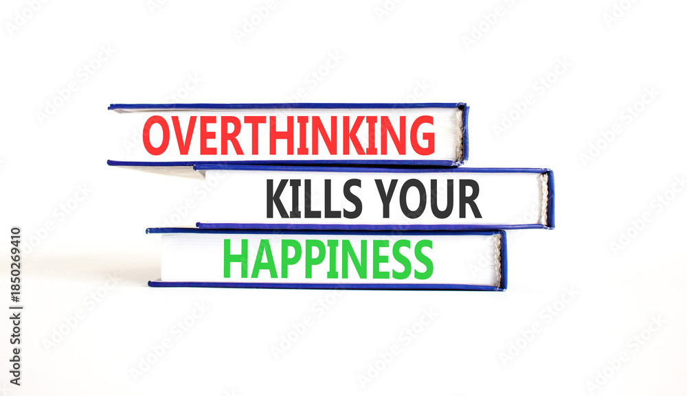 Fototapeta premium Overthinking kills your happiness symbol. Concept words Overthinking kills your happiness on books. Beautiful white paper background. Business overthinking kills happiness concept. Copy space.