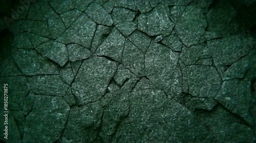 Cracked earth transformation: dark surface to vibrant green explosion