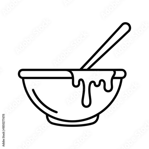 Honey in bowl with spoon