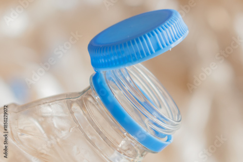 tethered plastic bottle cap innovation: new design ensures caps are recycled with the container