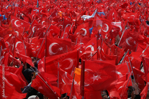 thousands of people holding Turkish flag
