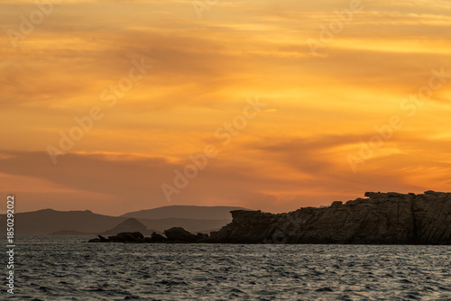 Golden Sunset Over the Aegean Sea and Rocky Coast, Greece