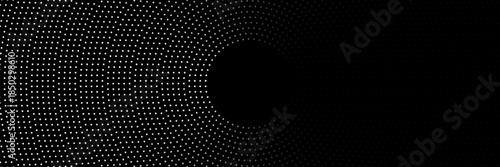 Minimalist abstract image featuring concentric dotted circles in shades of grey on a light background, creating a modern and tech-inspired circular pattern.