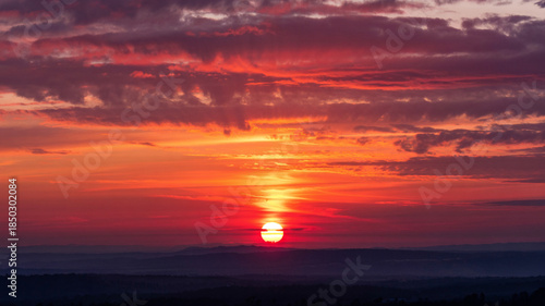 painting the sky with beautiful hues of red and gold