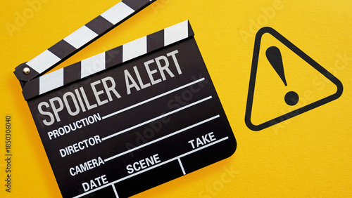 Fényképezés Spoiler Alert Concept with Film Clapperboard and Warning Sign on Yellow Backgrou