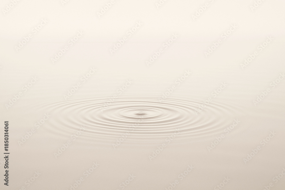Fototapeta premium Minimalist Water Ripple on Cream Surface Representing Calm and Serenity