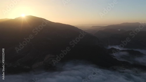 Aerial Sunrise Above the Clouds at Caminito del Rey, Guadalhorce Lake, and the Pine Forests of Andalusia, Spain