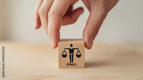 Business ethics concept. Business moral principles concept. Hand holds the wooden cubes with 