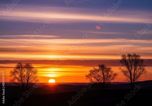 A breathtaking golden hour silhouette of a tranquil landscape at sunset, capturing the beauty and serenity of nature during the peaceful dusk light, stock, freedom, image