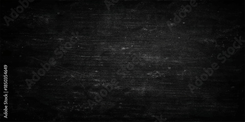 Dark grunge vintage wallpaper featuring a rough black concrete wall texture with aged gray paper effects on a dirty blank stone surface backdrop