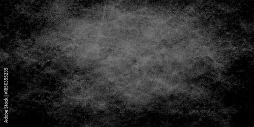 Abstract dark grunge background featuring a textured black and white surface with a vintage rough paper pattern and subtle smoky gray fog effects for a moody artistic backdrop