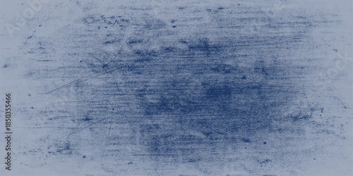 An abstract blue grunge background featuring a frozen winter texture of white snow and ice crystals on a cold weather surface with bright clouds and copy space