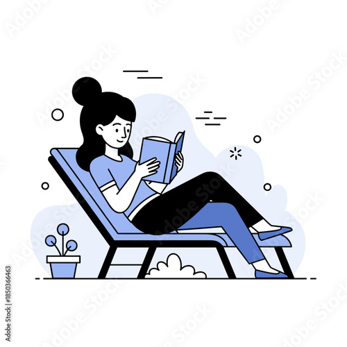 Young caucasian female relaxing outdoors on a lounge chair reading a book