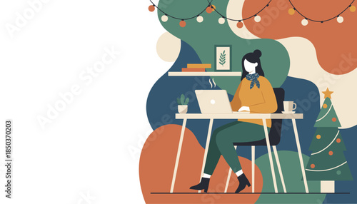 Remote worker using laptop in a cozy festive home office with Christmas decorations