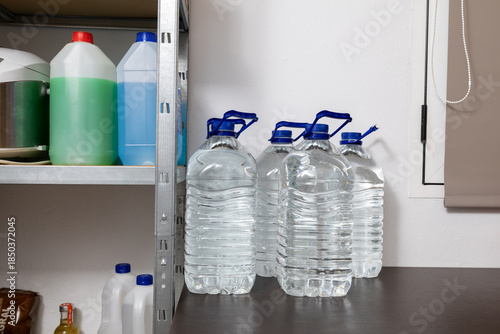 Water bottles stored on shelf for emergency preparedness
