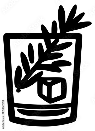 Whiskey glass with rosemary and ice cube