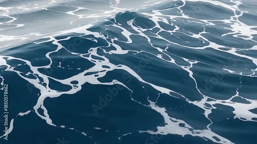 Dynamic Ocean Waves Rolling Across Open Sea.