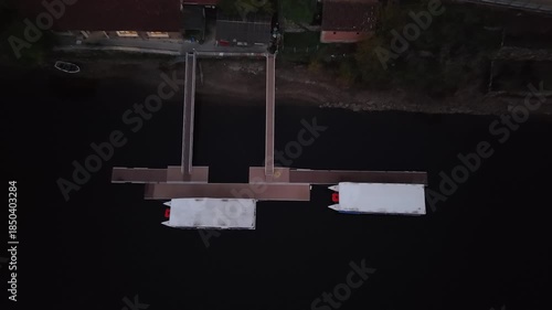 Belesar village with autumn vineyards reflecting in the tranquil miño river