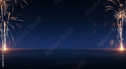 Vibrant fireworks display over serene ocean at night