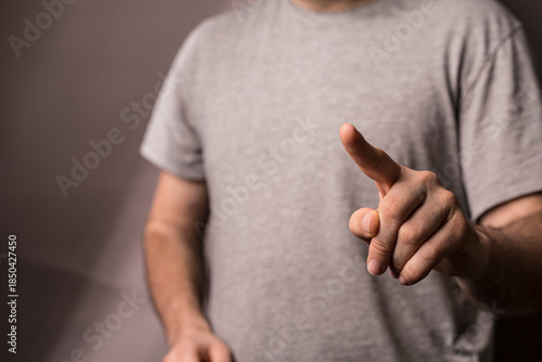 A man points his finger for...