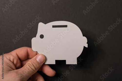 Person holding a paper pigg...