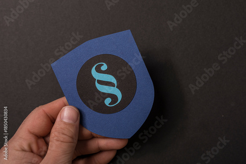 Person holding a blue paper...