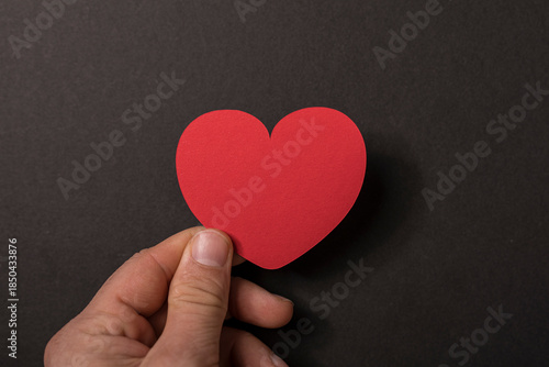 A person's hand holding a r...