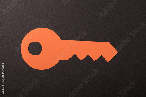 An orange paper key cut-out...