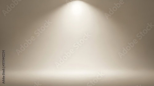 A minimalist beige studio background featuring a soft, cinematic spotlight shining from the top center onto an empty floor, creating a clean and professional stage effect.