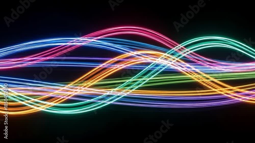 Vibrant multicolored neon light trails on a dark background creating a dynamic abstract pattern