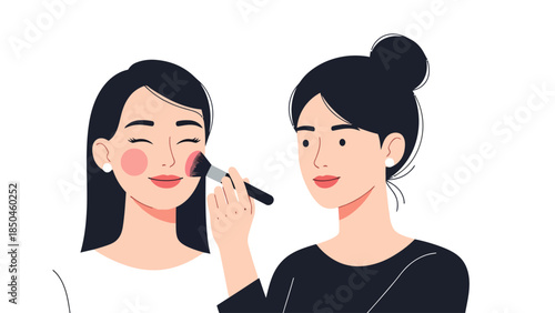 Two women with dark hair one applies blush to the others cheek