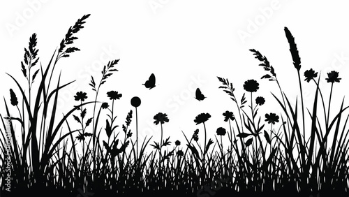 Silhouetted wildflowers and tall grass swaying gently in the breeze, a serene landscape scene viewed from the side
