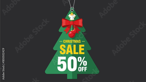 A Christmas tree ornament with a sale advertisement hanging against a dark background